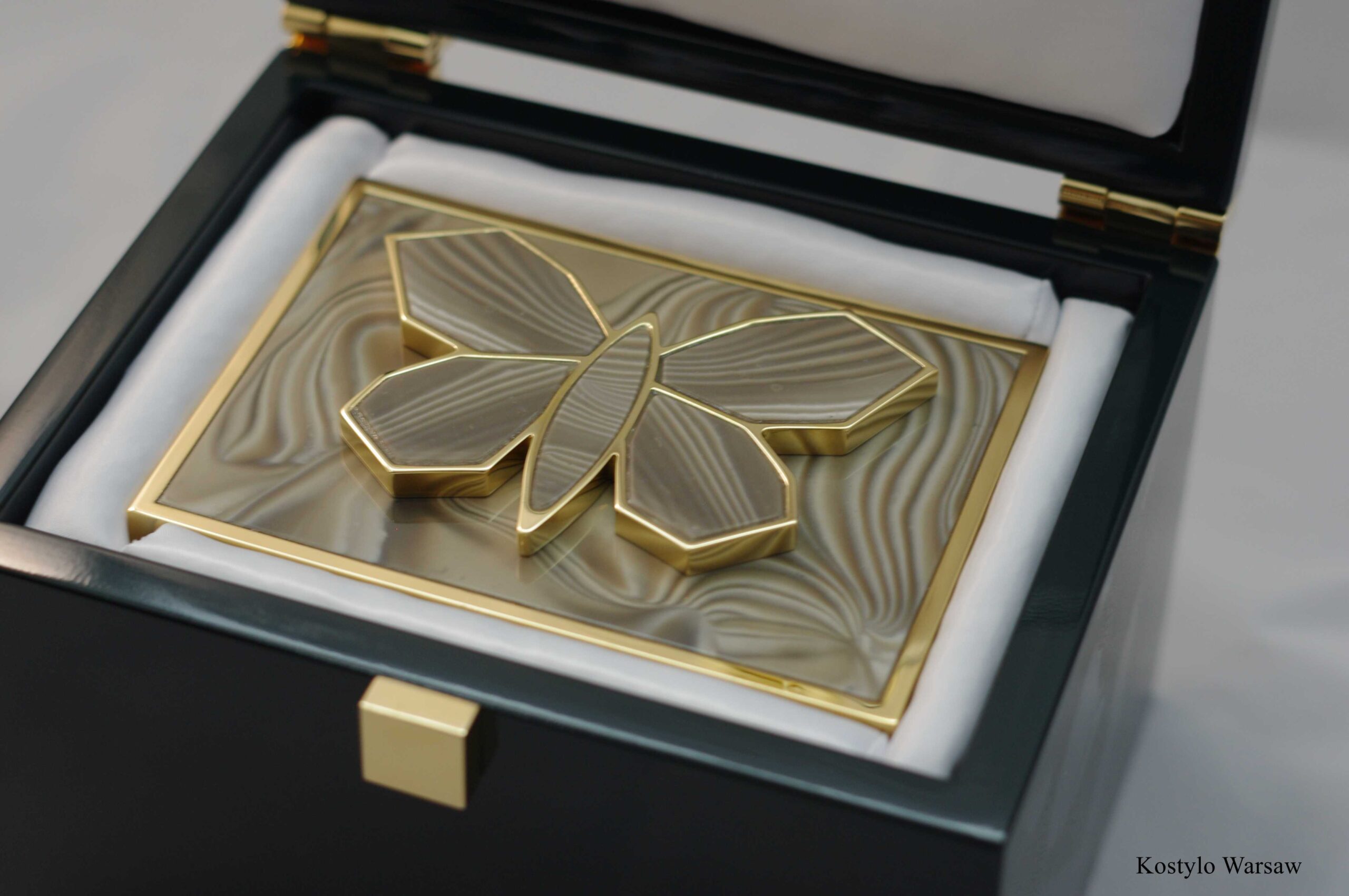 amazing_handmade_luxury_goldplated_belt_buckle_with_rare_striped_flint_stone_of_optimism_authored_by_kostylo_atelier A grand representation of luxury, buckle for luxury dress or skirt with an original sculpture of a butterfly figure, plated with pure Italian gold, in striped flint. It comes in luxurious branded box lined with satin, all handmade at Kostylo Atelier