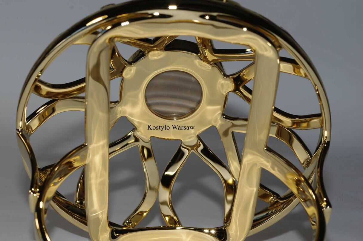 beautiful detail of high quality gilded figural lotus flower ring overlooking captivating striped flint authored Kostylo atelier