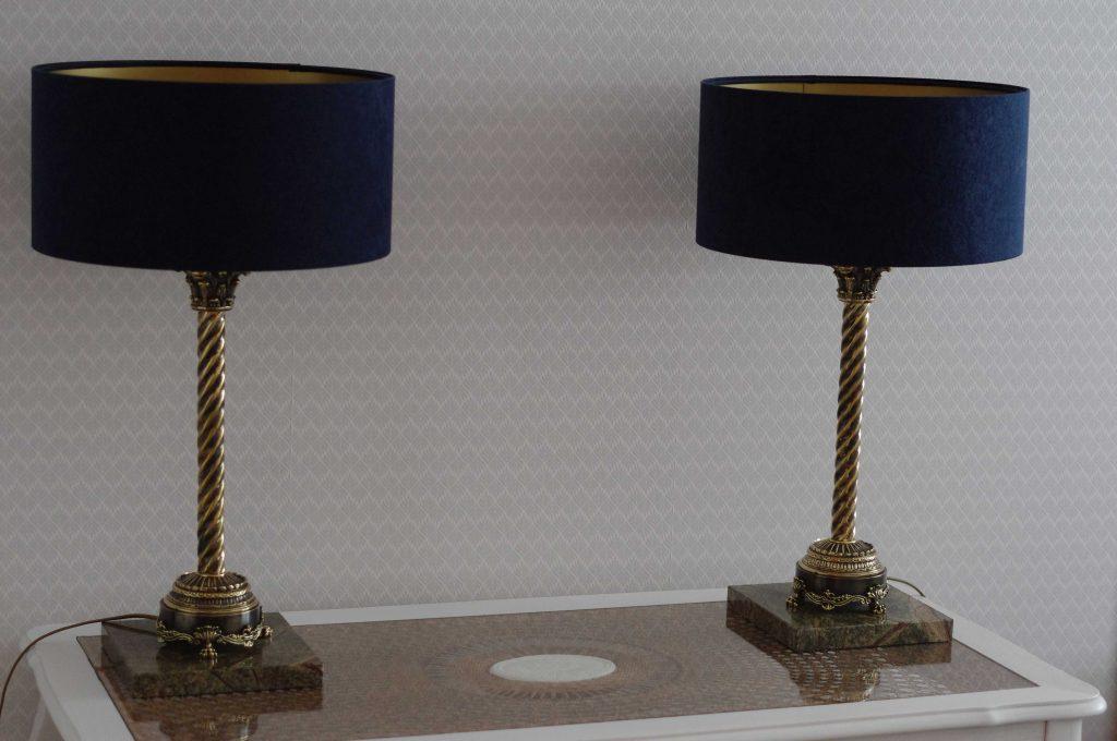 exclusive_living_room_stand_lamp_authored by_kostylo_atelier A pair of luxurious brass lamps, antiqued to an elegant bronze finish, featuring green marble bases and stylish shades, for sophisticated luxury interior authored handcrafted by Kostylo atelier