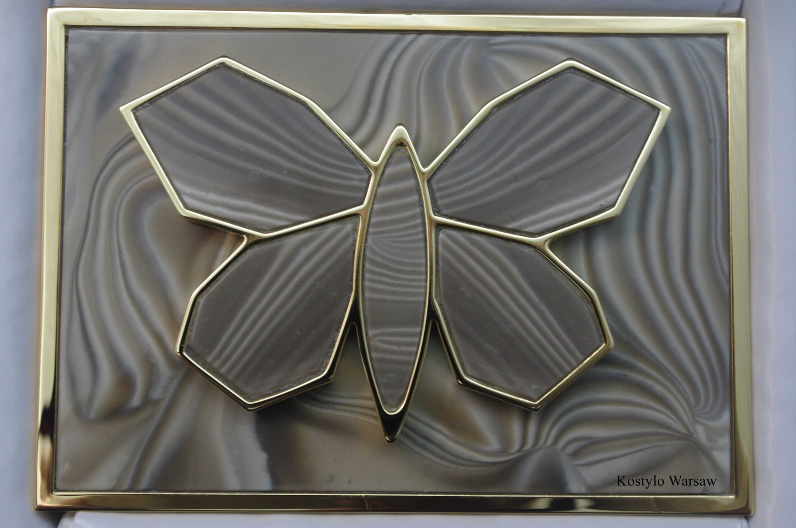 gold_plated_butterfly_figure_in_belt_for_dress_with_striped_flint_stone_by_kostylo_atelier A view straight ahead is very luxurious huge, gold-plated buckle with 23 karats of gold for a luxury skirt with a background of rare striped flint, handcrafted by the Kostylo atelier