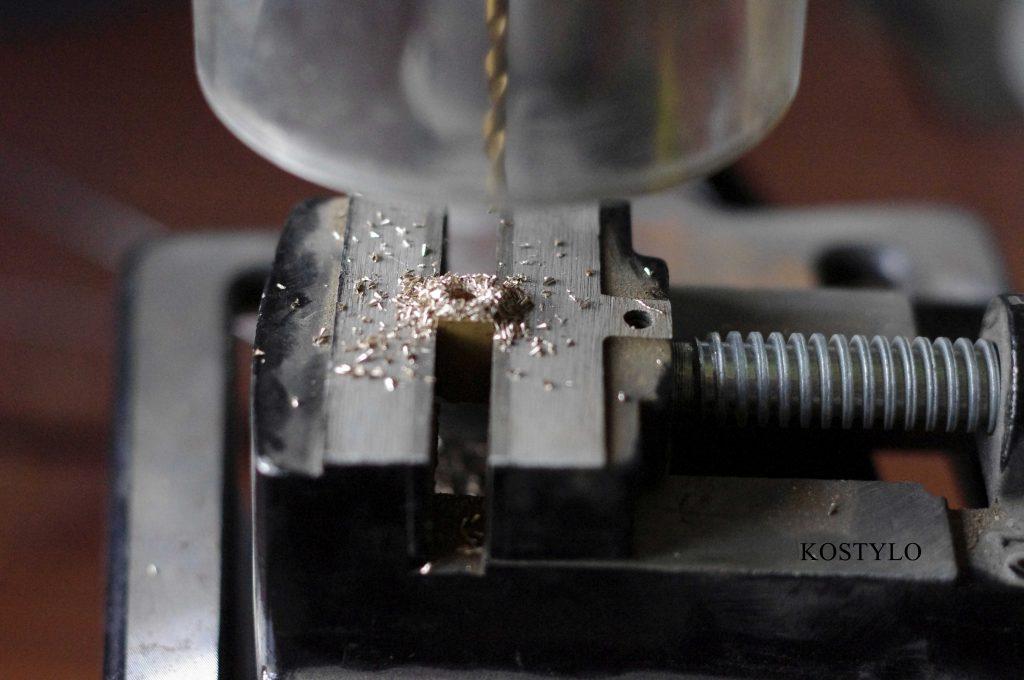 drilling hole in brass component for hinge or latch authored by the Kostylo atelier