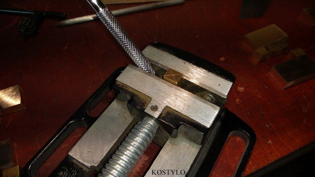 marking the centre to drill hole for unique hinge and latch designed by the Kostylo atelier