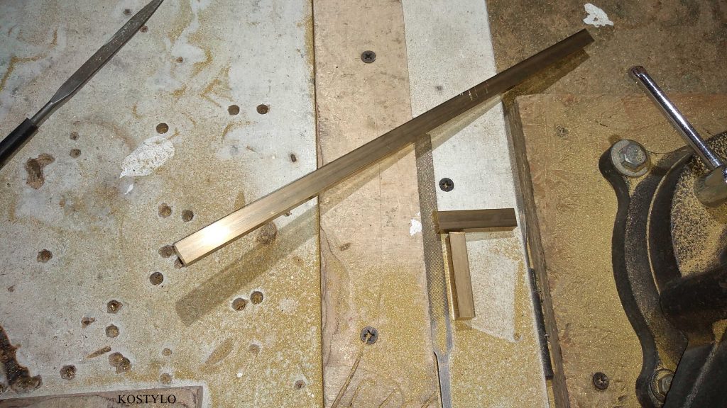 hand-cutting to size the brass components for custom hinges and latches authored by the Kostylo atelier