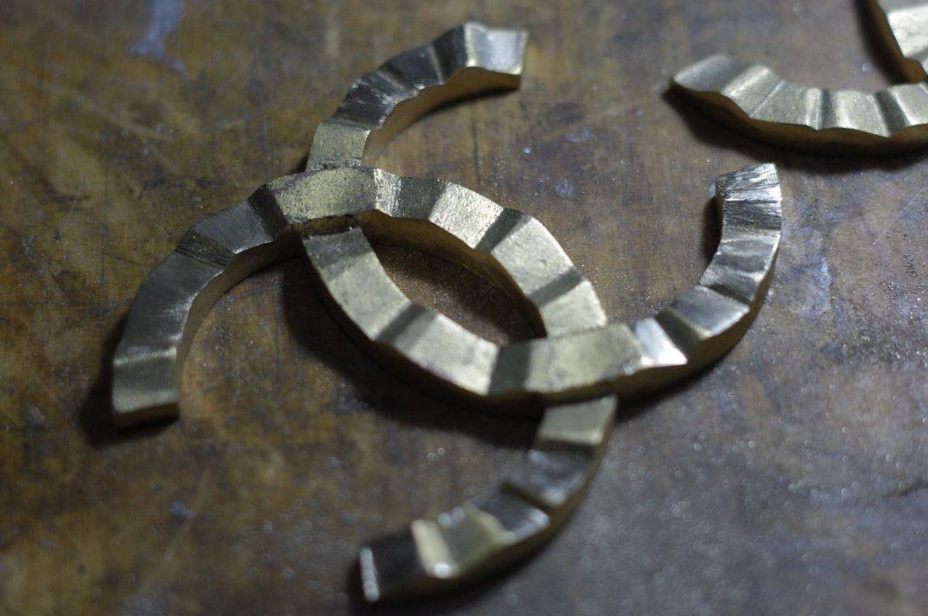 raw brass casting of the Coco Chanel logo which will be hand-grinding in the Kostylo atelier