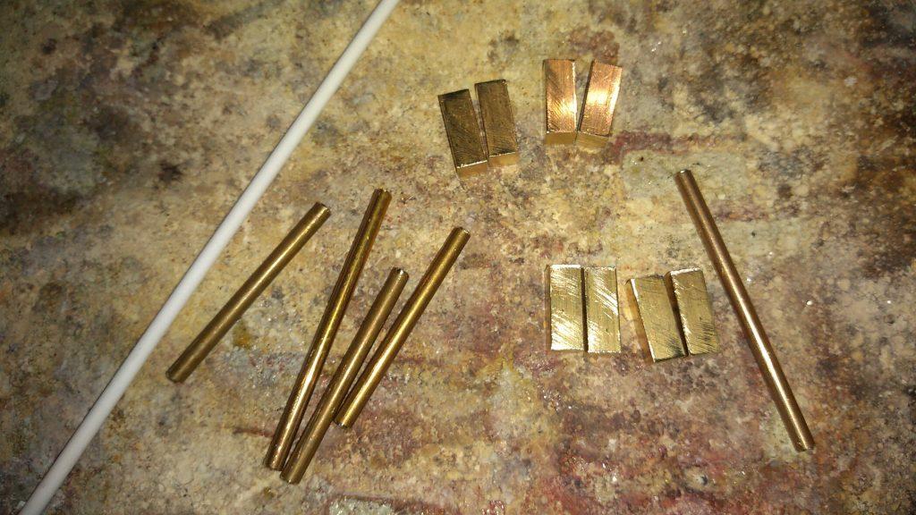 prepared brass elements sized before silver soldering on the back of the belt buckle, everything handmade only in the Kostylo atelier