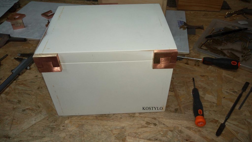 the box glued together from cut-to-size plywood pieces with custom hinges has been primed for later lacquering in our favourite company dark green colour by the Kostylo atelier