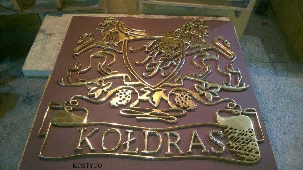 brass luxurious openwork bas-relief polished to high gloss, with custom company logo in the shape of crest featuring two lions with crown by Kostylo atelier