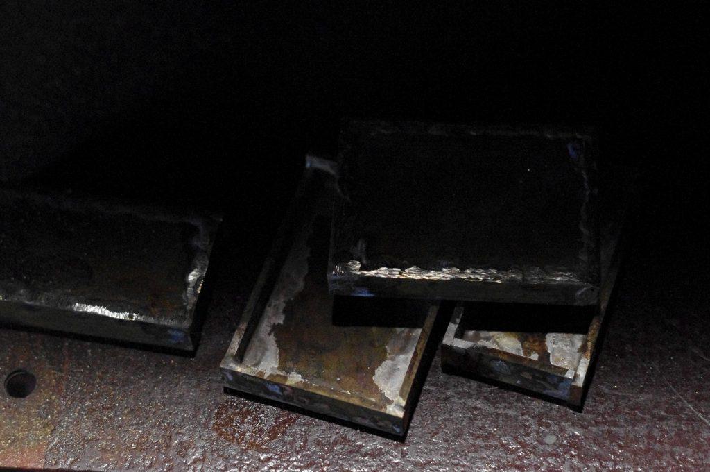 brass trouser buckles after silver soldering are waiting for manual grinding of excess silver, copper plating and gold plating, and installation of unique striped flint stone only in the Kostylo atelier