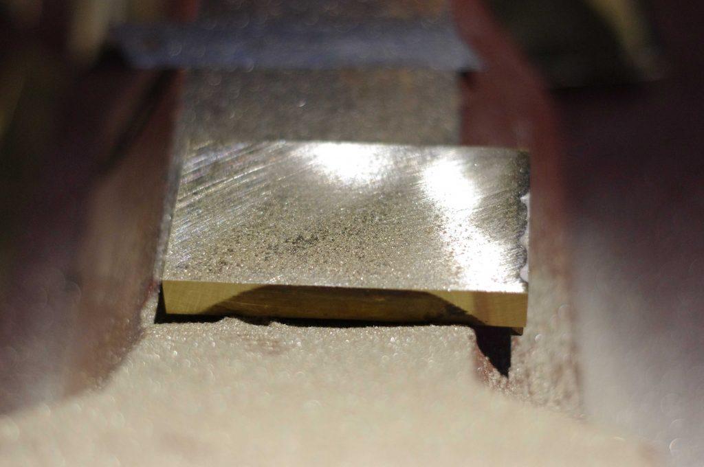 manual grinding of trouser buckle after silver soldering in the Kostylo atelier