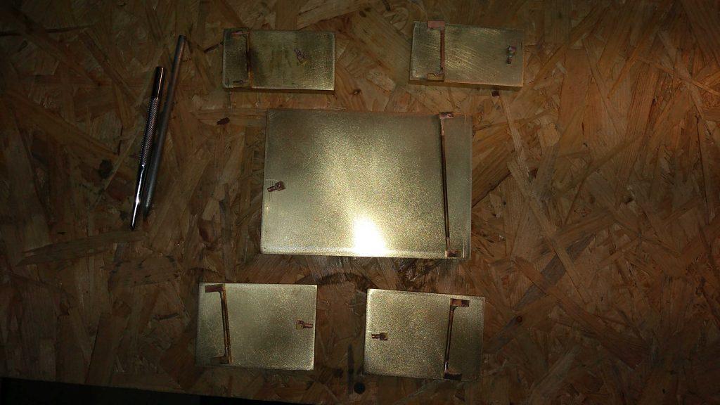 Soldered with silver and pre-grinded brass belt buckles along with components prepared for further silver soldering all handcrafted in the Kostylo atelier