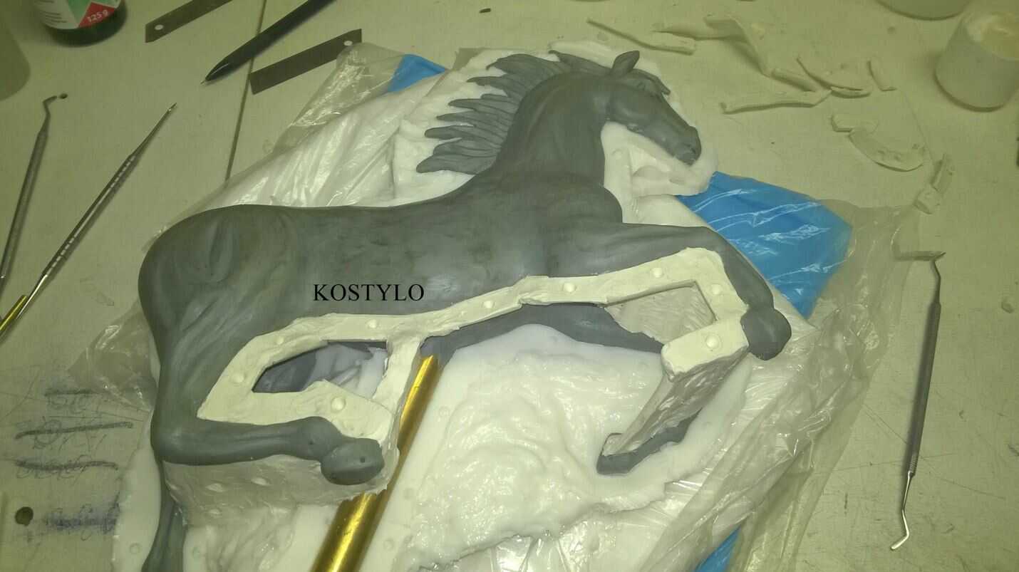 the approved sculpture of the Ferrari horse made from artist's clay is being prepared for silicone moulding, after which three-component wax will be poured into the created mould, done at the Kostylo atelier