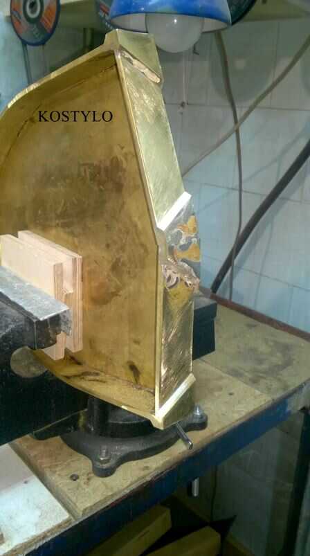 the base in the shape of the Ferrari emblem, silver-brazed from shaped sheets is hand-grinded in the Kostylo workshop