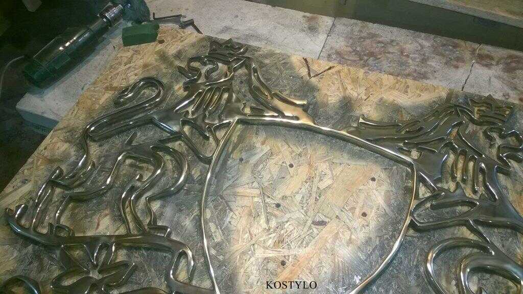 brass original luxurious company bas-relief, after hand grinding, is then polished with polishing compound to high gloss in Kostylo atelier