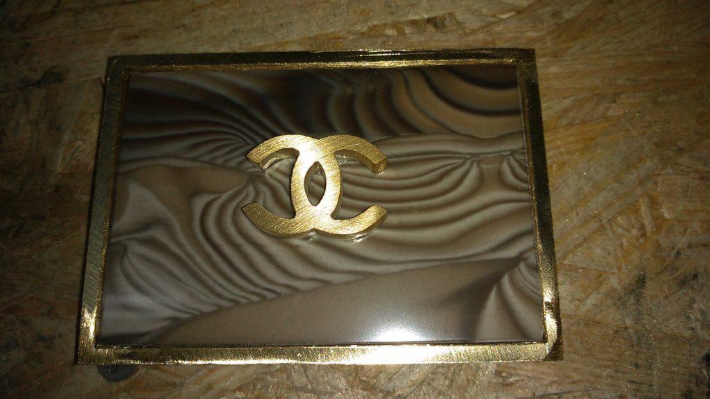 fitted rare striped flint and the coco chanel logo into silver-soldered belt buckle before processing in the Kostylo atelier
