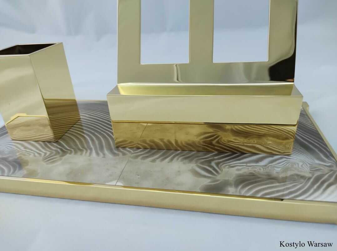 luxur gilded_modern_inkwell_for_pens_smartphones_authored_kostylo_atelier closeup shot of a luxurious original gold-plated inkwell, gold container for pens and cellphone support authored Kostylo atelier