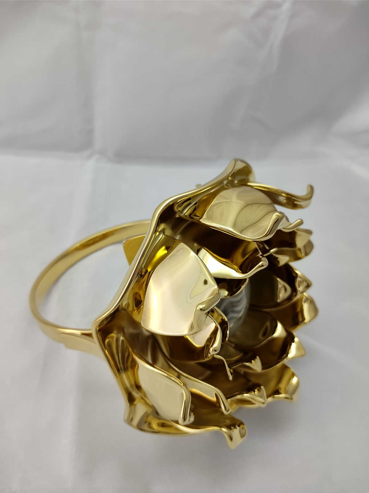 A very rare sculpture of a gold-plated ring in the shape of a lotus flower, along with high-quality striped flint by Kostylo atelier