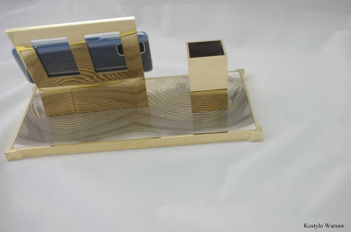 luxurious_gold_plated_inkwell_with_rare_striped_flint_authored_kostylo_atelier the back of unique luxurious inkwell in high-quality striped flint shiny with pure gold for pens and smartphone authored by Kostylo atelier