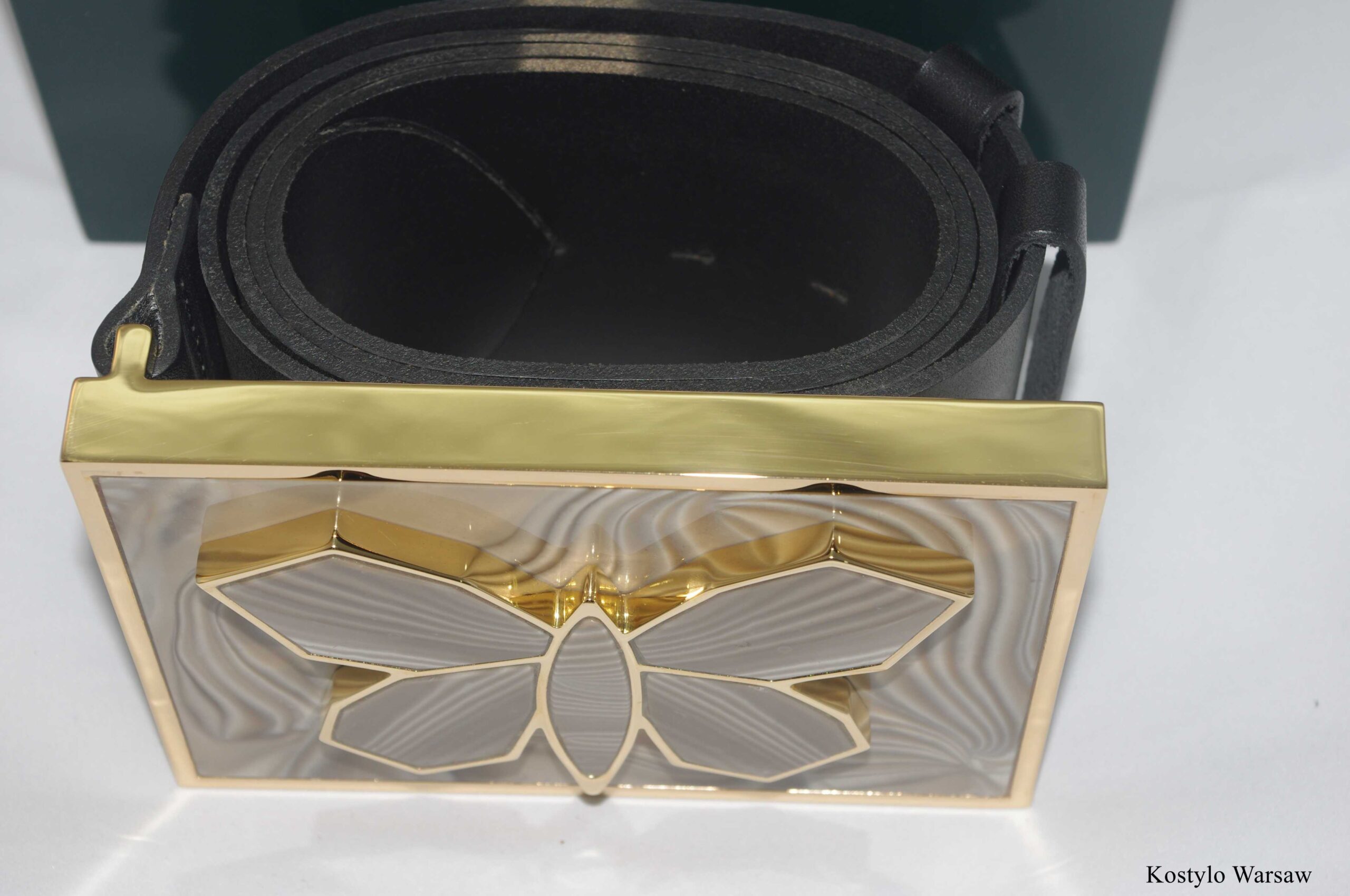 luxurious_handmade_gilded_belt_with_rare_striped_flint_stone_by_kostylo_atelier Top view of the original buckle for luxury dress, plated with 23 karat pure gold, featuring beautiful majestic butterfly inside, intricately cut from pieces of striped flint. High-quality black leather belt, all handmade at Kostylo atelier