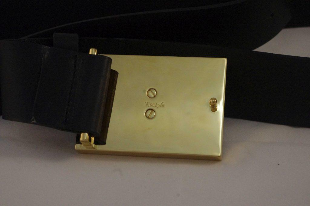luxurious_italian_23k_gold_plated_high_quality_trouser_belt_authored_kostylo_atelier The back of the luxurious belt, gold plated with Italian 23-carat gold, with jeweler-grade screws, indicating high-quality goldsmithing, handmade by Kostylo atelier