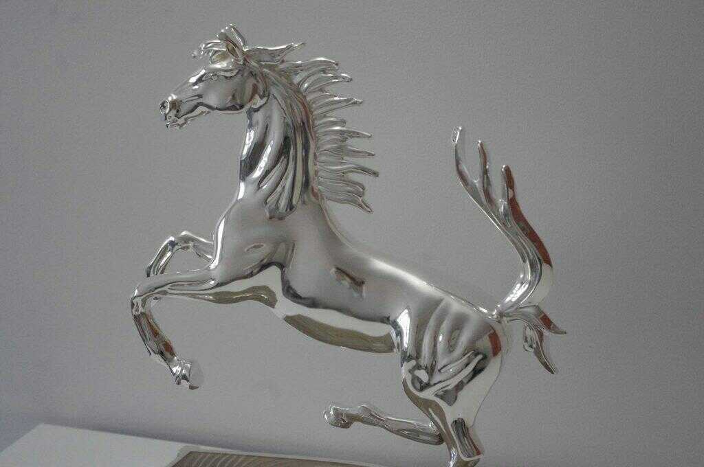 luxury_ferrari_horse_logo_sculpture_by_kostylo_atelier Luxurious silver sculpture of a Ferrari horse intricately and handcrafted by kostylo atelier