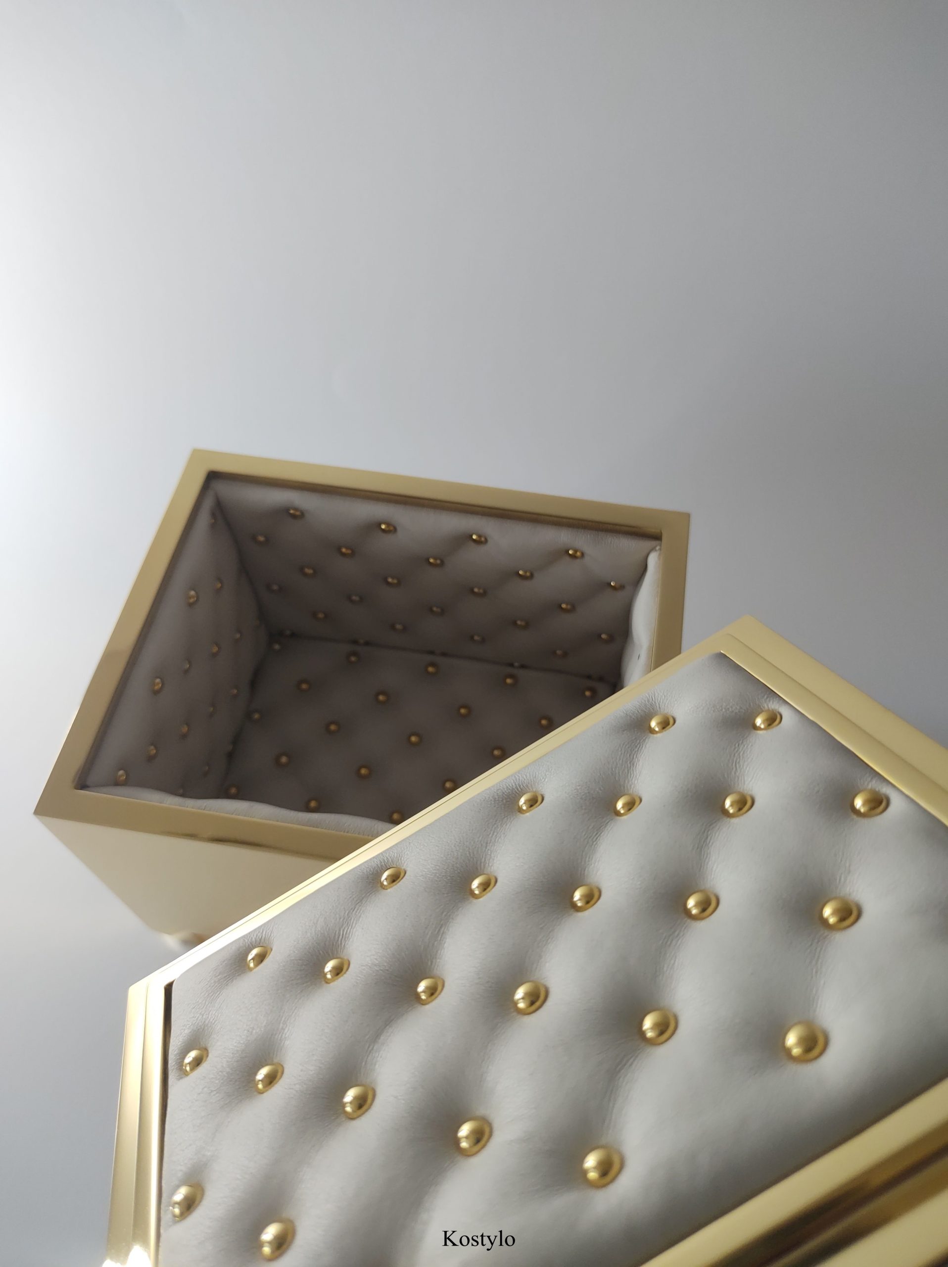 luxury_gold_plated_box_with_quilted_interior_of_luxurious_high_quality_leather_by_kostylo_atelier beautiful interior of luxury gold plated box with quilted leather lining, handcrafted with 23-karat gold by kostylo atelier