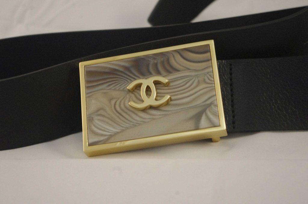 luxury_trouser_belt_with_coco_chanel_buckle_as_great_inspiration_handcrafted_by_kostylo_atelier luxurious belt model with the Coco Chanel logo, gilded with Italian 23-carat gold and featuring rare striped flint. We are inspired by the Coco Chanel brand and the belt is not for sale