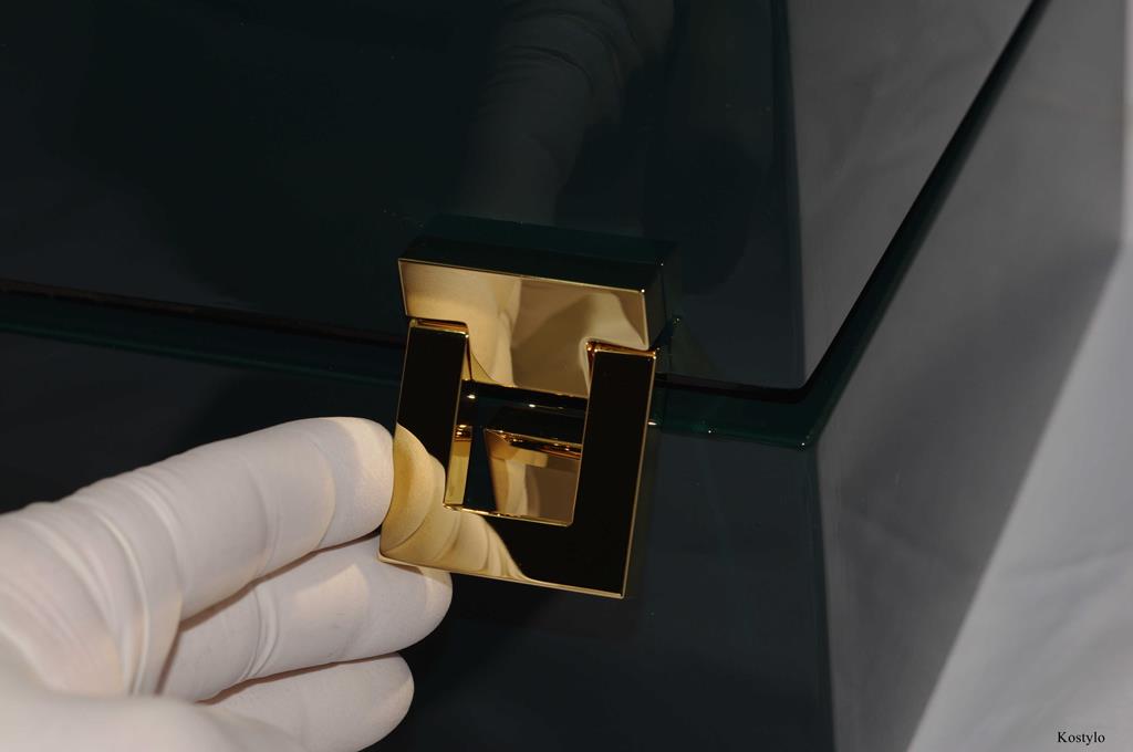 dark green branded box with handcrafted gilded clasps and hinges for luxurious figurative jewelry box by Kostylo atelier