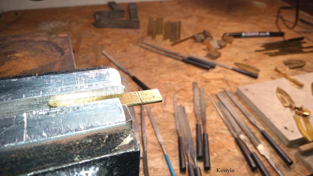 Manually cutting each element of the wings, sides, and base to create the butterfly bas-relief by Kostylo atelier