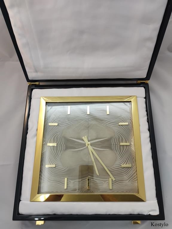 Luxury modern European design wall clock in luxurious dark green branded box by Kostylo atelier