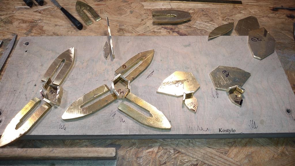 Adjusting each tiny element of the butterfly bas-relief wing for the future luxury belt buckle by Kostylo atelier