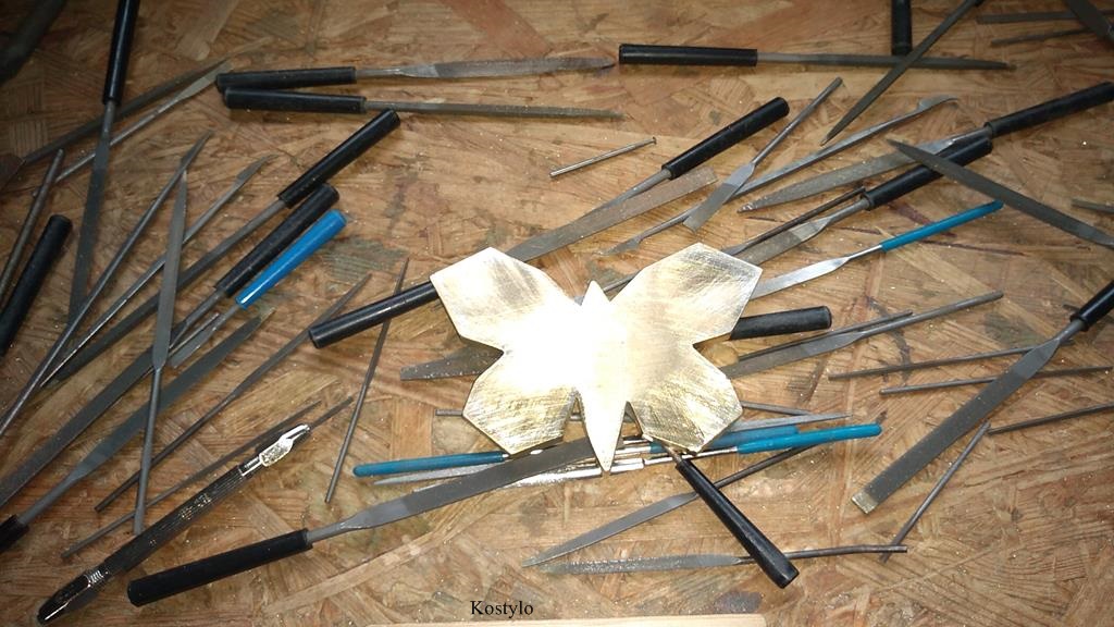 Manually grinded to remove excess silver solder on the underside of the butterfly bas-relief for future luxury buckle by Kostylo atelier